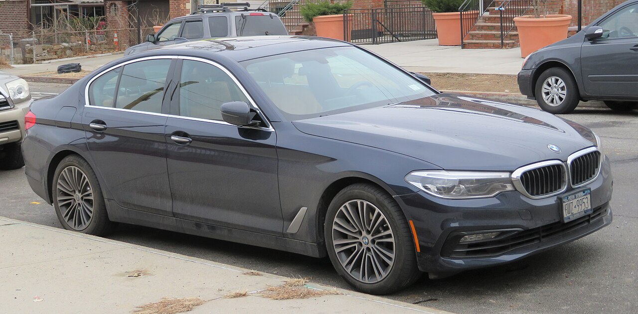Blue-grey early G30 BMW 540i xDrive front view