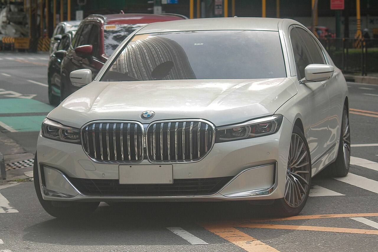 White facelift BMW 730i front three-quarter view