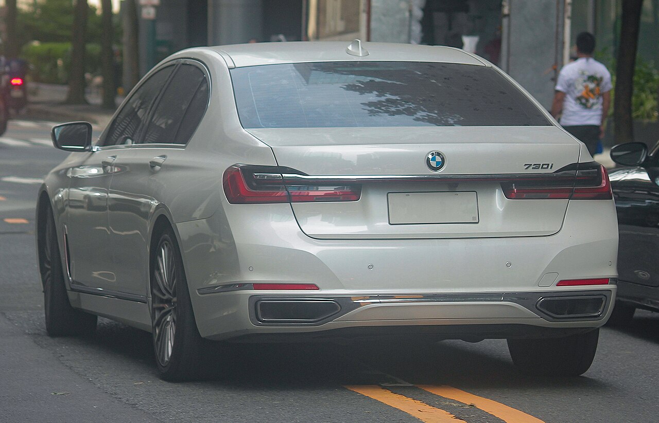 White facelift BMW 730i rear view