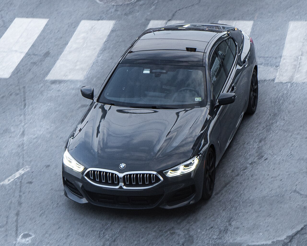 Dark BMW 840i G16 Gran Coupe from the front and above