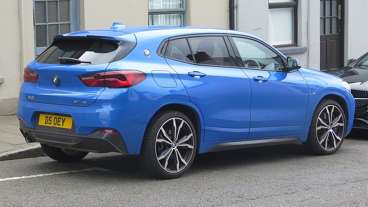 Blue BMW X2 sDrive18i F39 rear view with badge