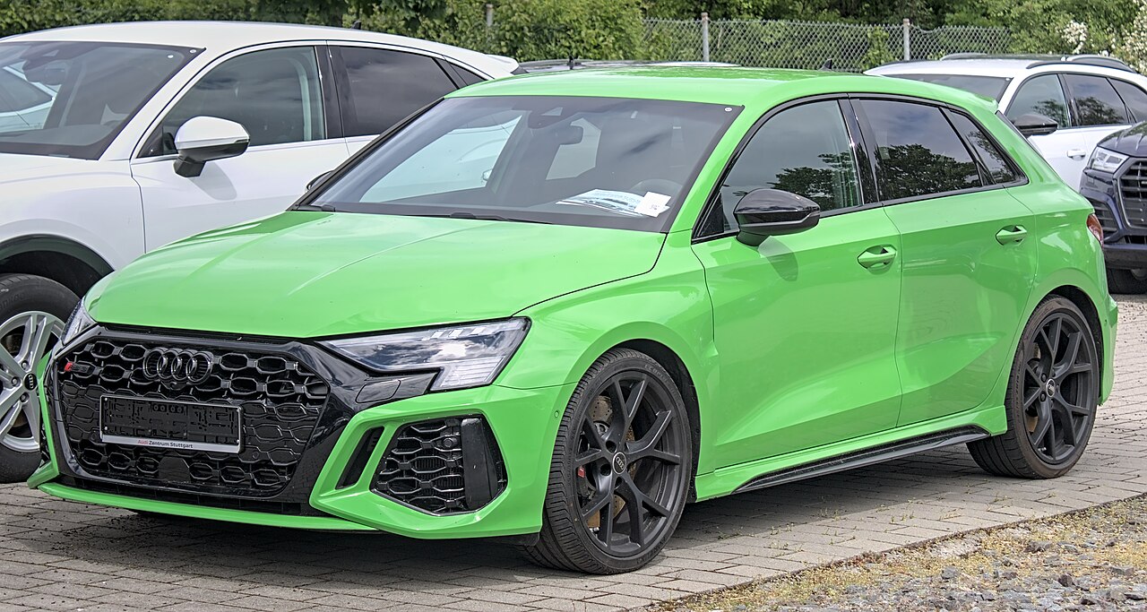 Green Audi RS 3 8Y Sportback front and side