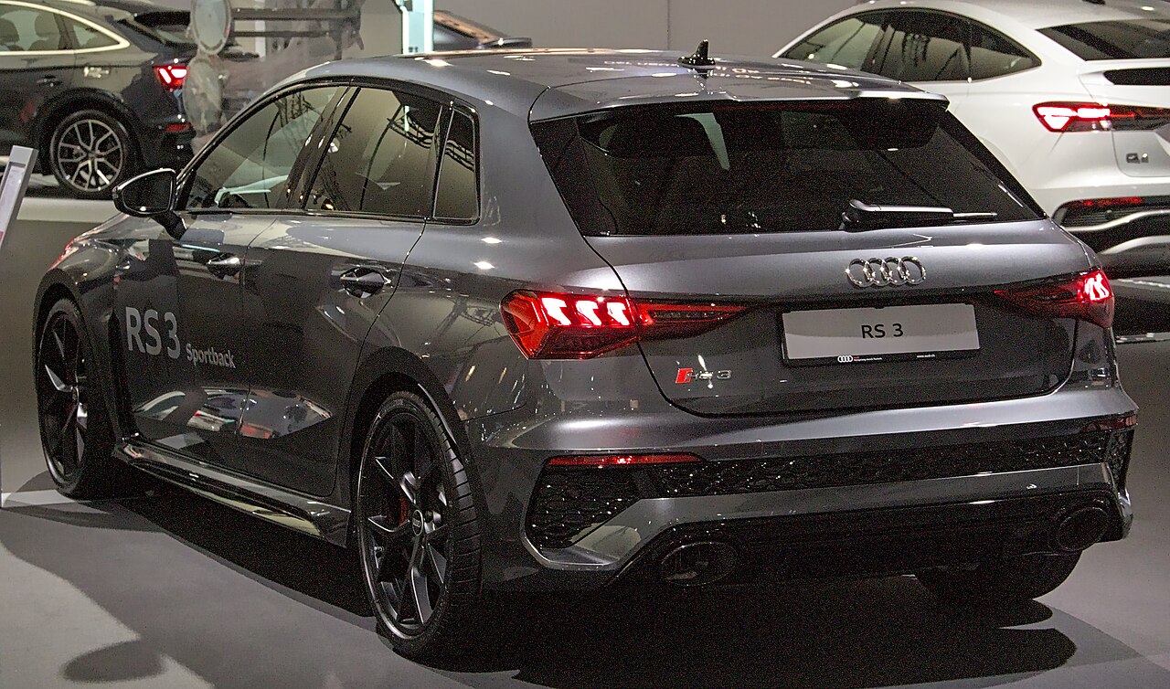 Grey Audi RS 3 8Y Sportback rear at a motor show