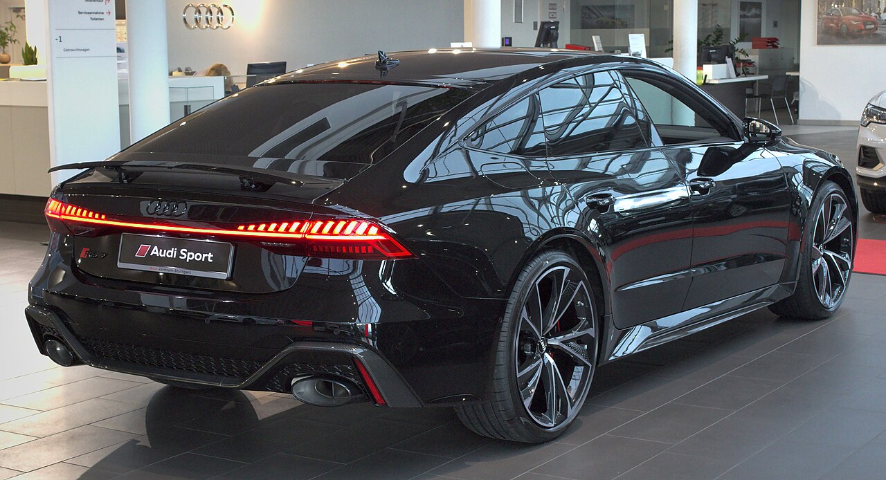 Dark Audi RS 7 C8 in a showroom