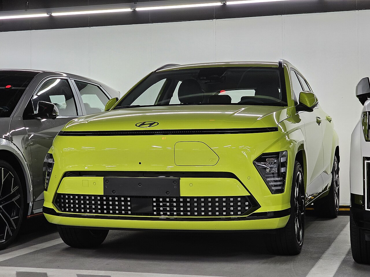 Yellow Hyundai Kona Electric with front charging flap