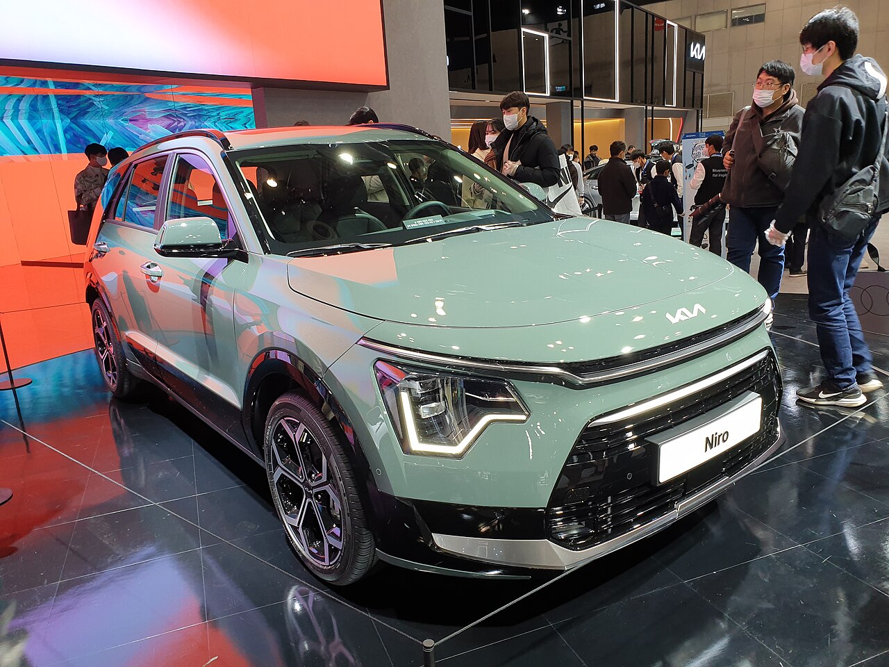 Green Kia Niro SG2 hybrid at a display