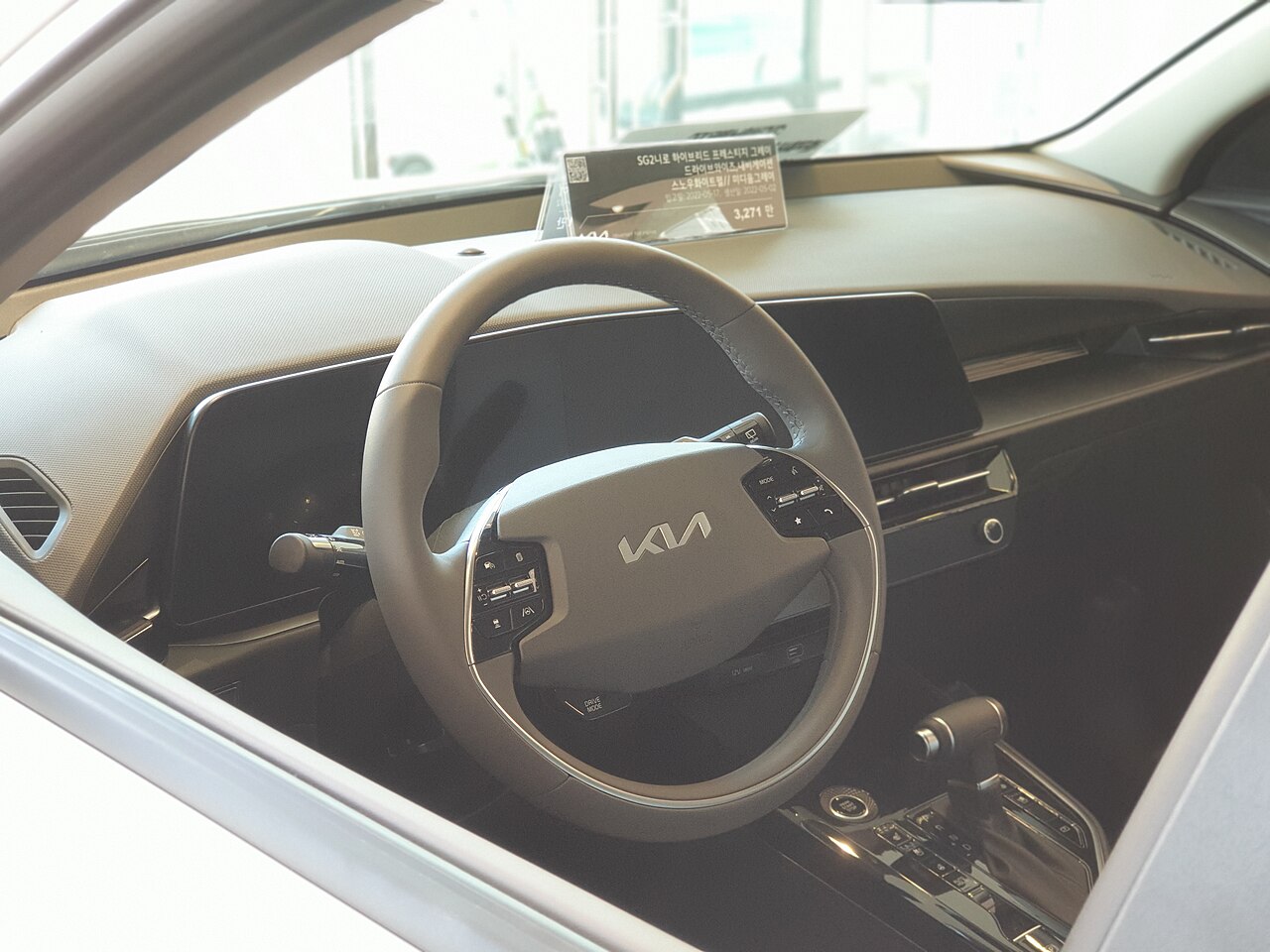 Kia Niro SG2 cockpit viewed through a window