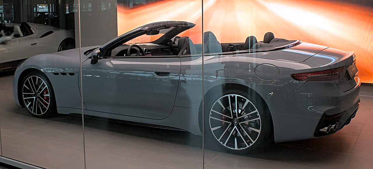 Light blue Maserati GranCabrio Trofeo behind display glass