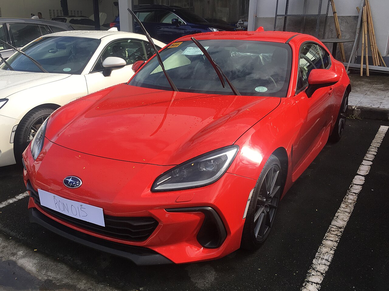 Red second-generation Subaru BRZ manual at a display