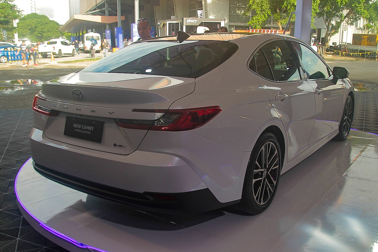 White XV80 Toyota Camry hybrid rear at PIMS 2024