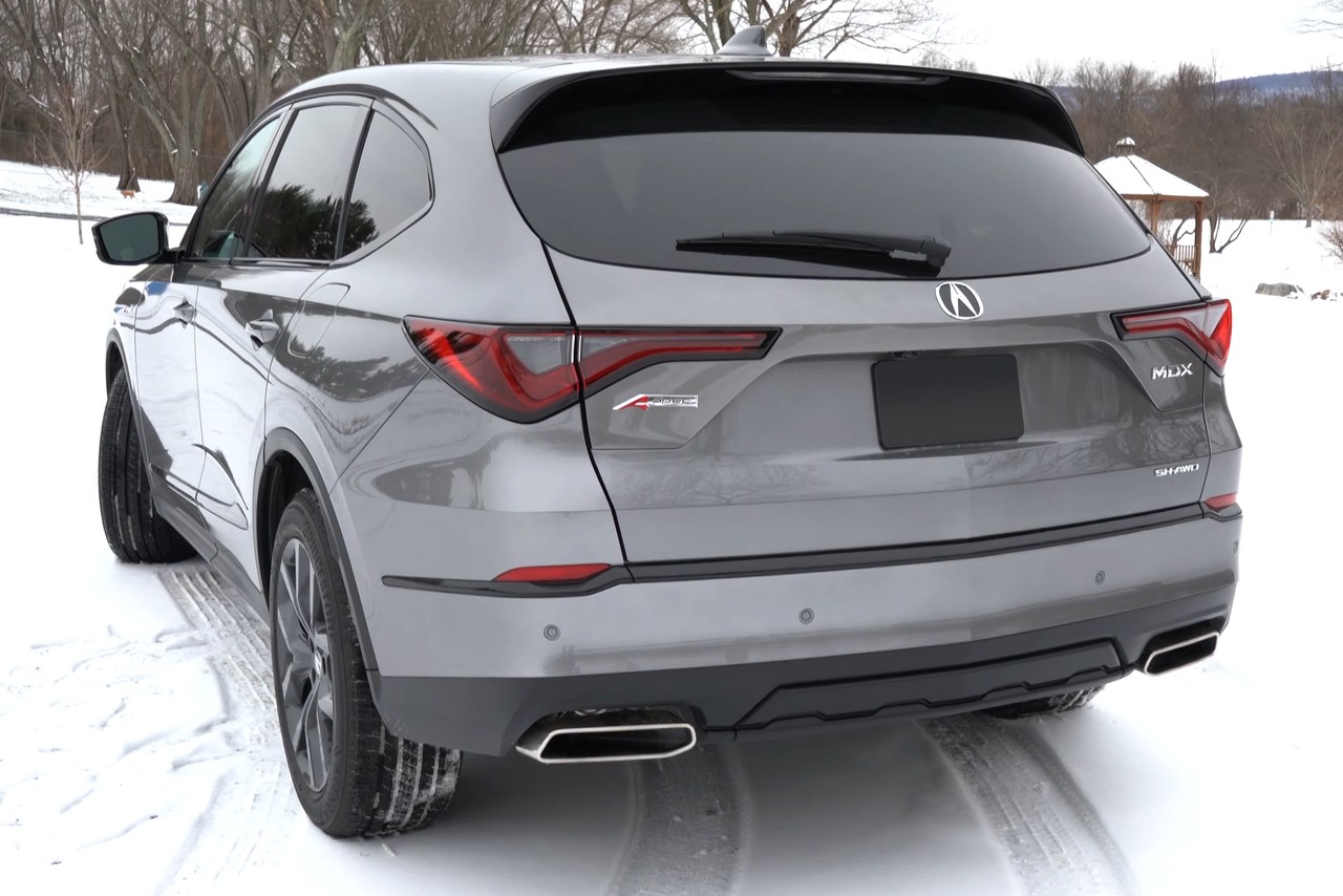 Grey 2022 Acura MDX, rear three-quarter view