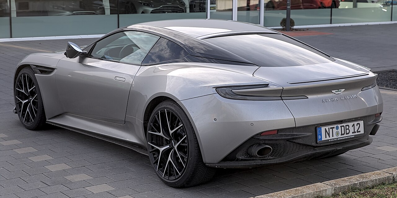 Silver Aston Martin DB12 Coupe, rear three-quarter view