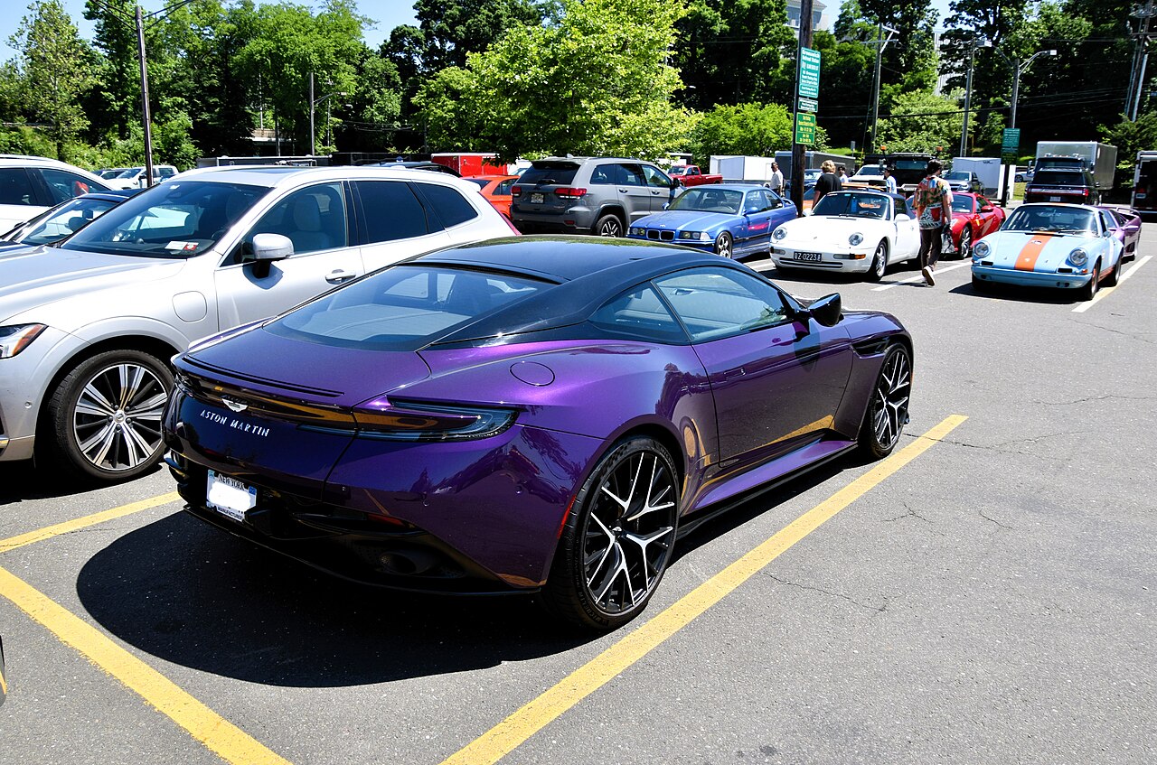 Purple Aston Martin DB12 Coupe, rear three-quarter view