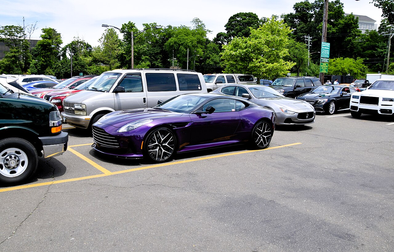 Purple Aston Martin DB12 Coupe, side and front view