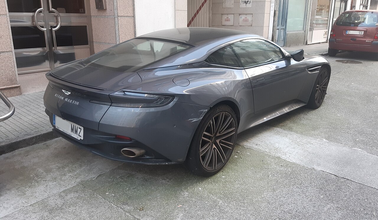 Grey Aston Martin DB12 Coupe, rear three-quarter view