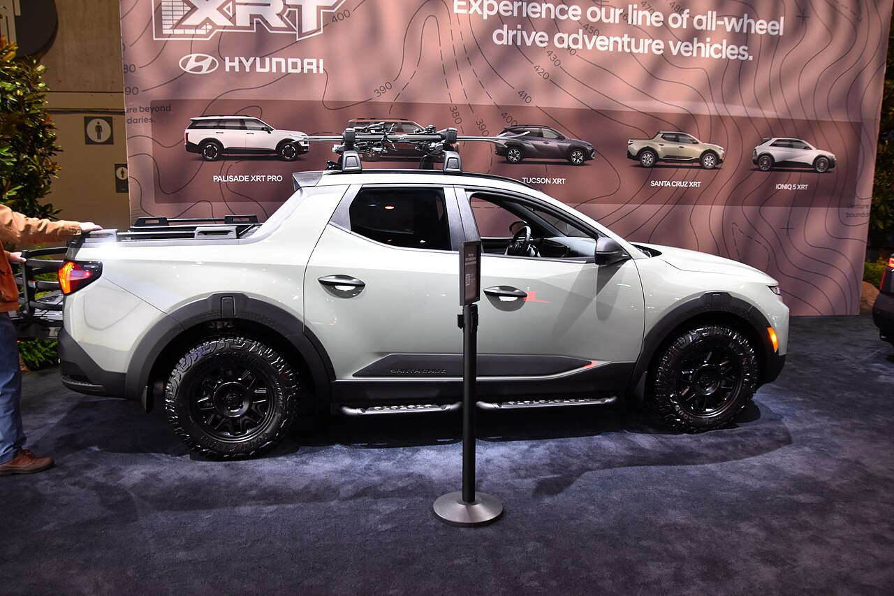 White Hyundai Santa Cruz XRT, side profile at a display