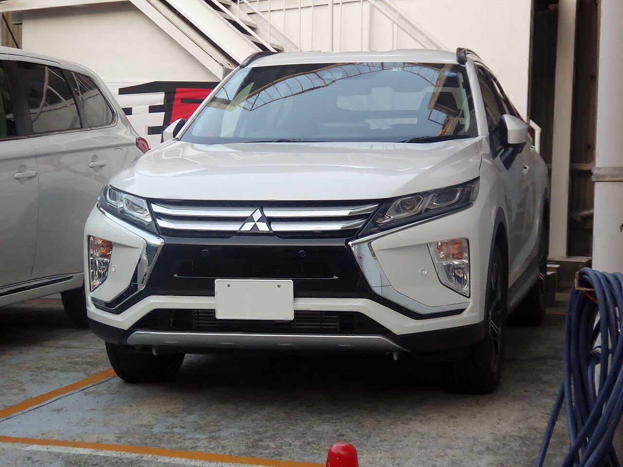 White Mitsubishi Eclipse Cross G, front view