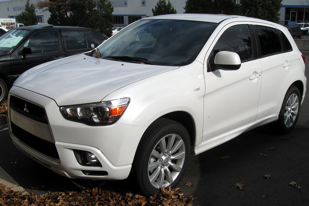 White 2011 Mitsubishi Outlander Sport, front three-quarter view