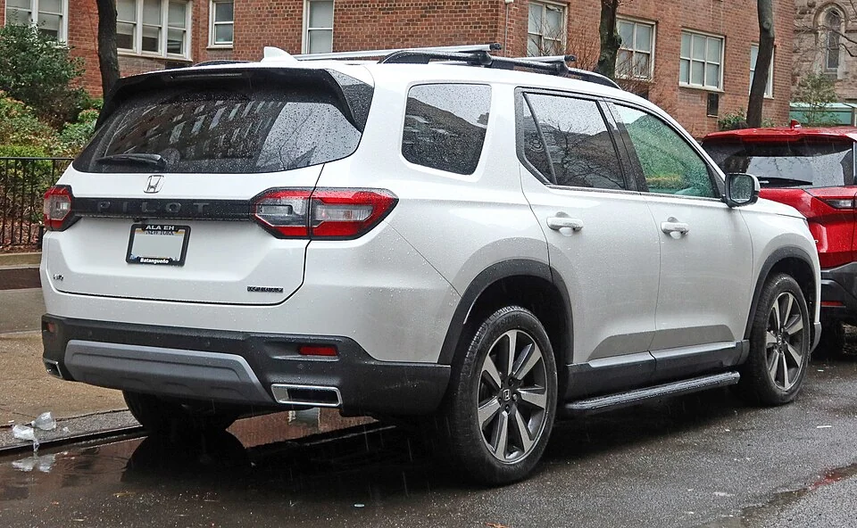 Rear exterior — 2023 Honda Pilot Touring, an earlier fourth-generation body reference; equipment is not a confirmation of MY2025 specification.
