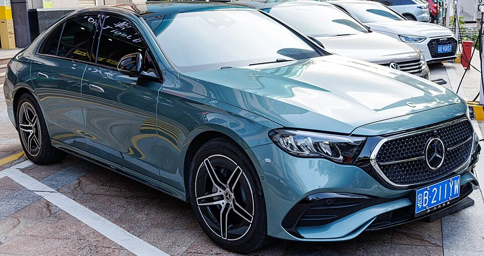 Front exterior — Mercedes-Benz E-Class W214 photographed in China; overseas body reference, not verification of U.S. MY2024 equipment.