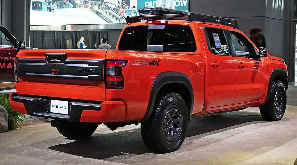 Rear exterior — 2025 Nissan Frontier PRO-4X at the New York auto show; off-road trim equipment is not standard on every Frontier.