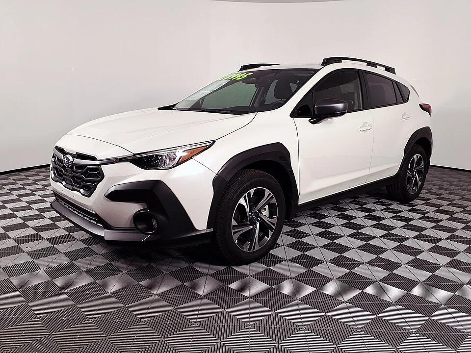 Front exterior — 2024 Subaru Crosstrek photographed in the United States; front Premium example and a separate rear view.