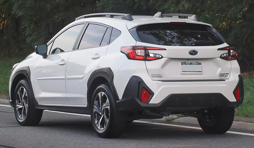 Rear exterior — 2024 Subaru Crosstrek photographed in the United States; front Premium example and a separate rear view.
