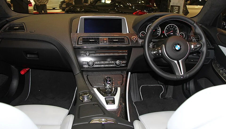 Interior — BMW M6 Gran Coupe F06 exterior and Japanese right-hand-drive interior reference; cabin configuration is market-specific.