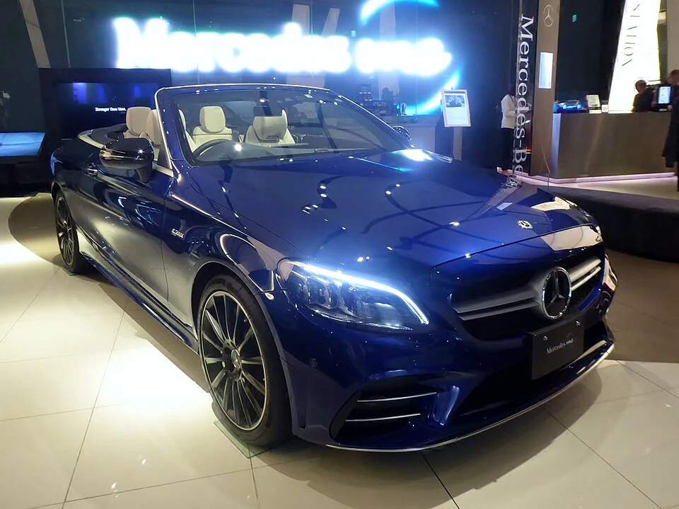 Front exterior — Mercedes-AMG C43 A205 cabriolet photographed in Japan; right-hand-drive reference, not confirmation of U.S. MY2021 equipment.