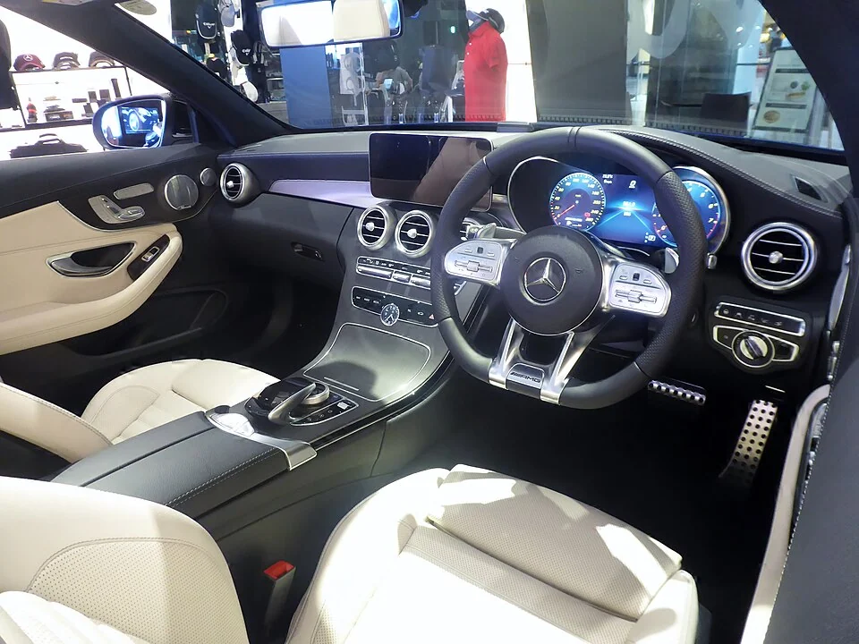 Interior — Mercedes-AMG C43 A205 cabriolet photographed in Japan; right-hand-drive reference, not confirmation of U.S. MY2021 equipment.